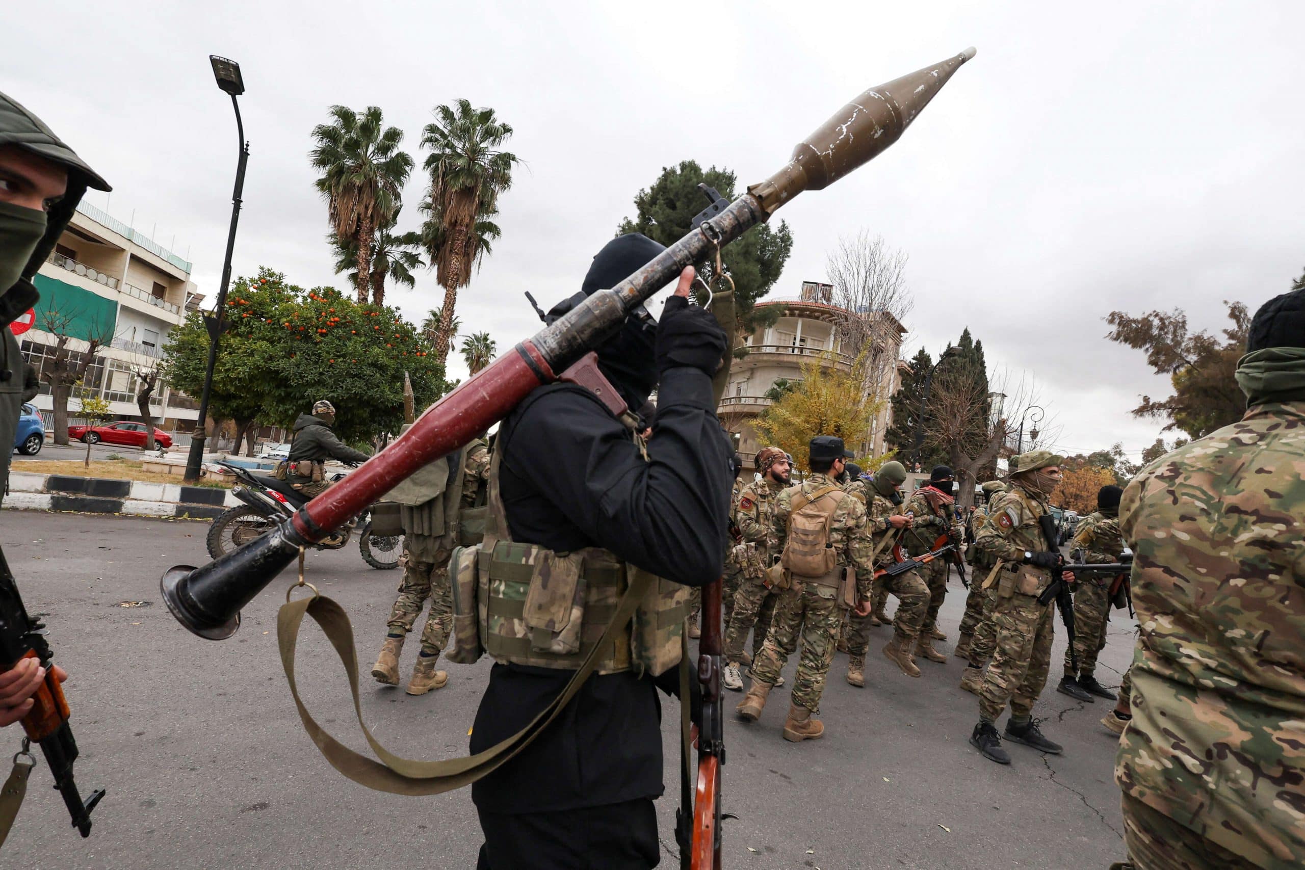 FILE PHOTO: Khaled Brigade, a part of Hay'at Tahrir al-Sham (HTS), hold a military parade, in Damascus